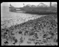 Crowd celebrating the Fourth of July on the beach near Lick Pier and Ocean Park Pier, Venice, 1929