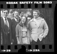 Patricia Hearst, wearing a "Pardon Me" T-shirt with Bernard Shaw in Hillsborough, Calif., 1979