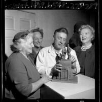 Sculptor Henry Van Wolfe with members of North Hollywood Women's Club viewing model of Treaty of Cahuenga statue, 1965