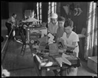 Irving Wells, Kenneth Atherton, and Roland Asher woodworking at an exhibit of arts and crafts and hobbies, Los Angeles, 1935