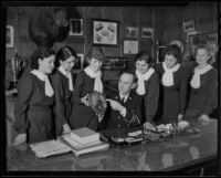 Fire Chief Scott presenting a fire prevention award to students of the Sacred Heart High School, Los Angeles, 1935