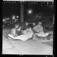 Williams family bedding down on Colorado Blvd. in wait for the Rose Parade, Pasadena, Calif., 1966