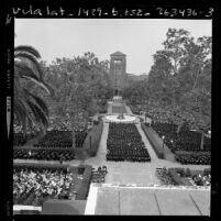 USC students in gowns and caps during commencement ceremony in Alumni Memorial Park, 1970