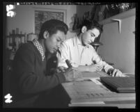 Miguel Ungson and Alfredo Santa Cruz wood carving at Spanish-American Institute in Gardena, Calif., 1954