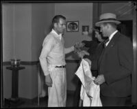 Assailant William Hardy in handcuffs with detective Joe Filkas, Los Angeles, 1935