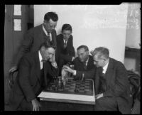 B. G. Adams and Dr. Emanuel Lasker play chess as other watch at the L.A.A.C., Los Angeles, 1926