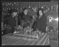 Mrs. William T. Sesnon Jr., Daisy Parsons, and Mary Crowell at the Junior Leaguers silver exhibit, Los Angeles, 1936