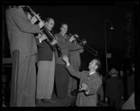 Dick Powell leads a band, Pasadena, 1942