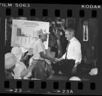 Presidential candidate Walter Mondale shaking hands with employee at Ralph's meat packing plant in Compton, Calif., 1984