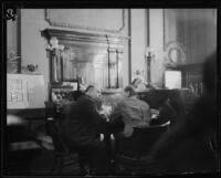 Albert A. Mors and Deputy District Attorney Fricke sit in court during the Kid McCoy case, Los Angeles, 1924