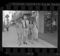 Hubert de Givenchy with models Billy Blair, Ritsuko and Lynne in Beverly Hills, Calif., 1978