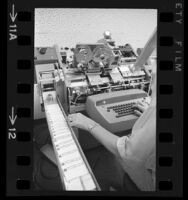 Carte Blanche credit cards being feed into printing machine, 1967