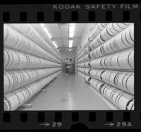 Librarian Barbara Nichols, filing reels of computer tape at Los Angeles County computer center in Downey, Calif., 1976