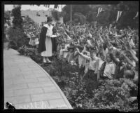 Aimee Semple McPherson with children during Angelus Temple services, Los Angeles, 1926