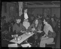 Antoinette Mahoney waits on a table with Rosalind Metcalfe, Marian Marsh, and Mrs. Norman Herman, Los Angeles, 1936