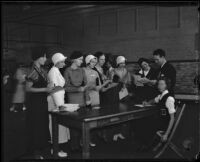 Christy Welch and Orville Mohler help freshmen students: Nancy Monroe, Grace Houck, Jennie Bevis, Frances Townsend, Phyllis Livingston, Harriett Lemka, and Helen Burnside, Los Angeles, 1932