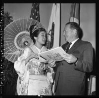 Nisei Festival Week Queen speaks with Los Angeles Mayor Sam Yorty, Los Angeles, 1967