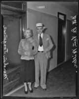 Actress Marchen Jorgensen with a detective after her arrest, Los Angeles, 1935