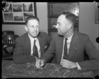 Flood control engineers Paul Baumann and Harold E. Hedger with map of Angeles National Forest, 1934