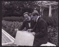 William A. Clark Jr. sitting next to composer Dane Rudhyar, Los Angeles, 1922