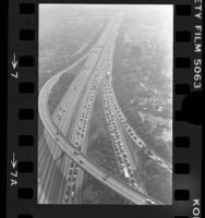 Aerial view of traffic on Santa Monica Freeway the day HOV lane started, Los Angeles, 1976