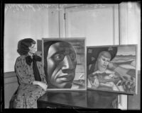 Mildred Manta shows two paintings from the Los Angeles County Relief Administration program, Los Angeles, 1935