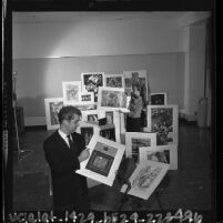 Walter Askin and Betty LaDuke surrounded by prints at the 10th anniversary Westside Jewish Community Center's art exhibit, Calif., 1964