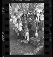 Ceola Millner and her five children of Watts, Calif., waiting to board bus to Washington, D.C. for Poor People's Campaign, 1968