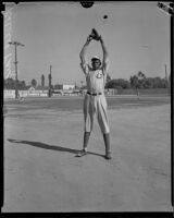 Baseball pitcher Satchel Paige in a baseball field ready to pitch, Los Angeles, circa 1933