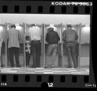 Four men in polling booths in Los Angeles, Calif., 1986