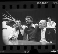 Bill Sharman, Kareem Abdul-Jabbar and Jack Kent Cooke at press conference announcing Lakers' signing Kareem in Los Angeles, Calif., 1975