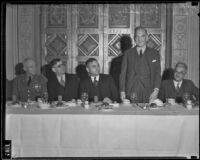 Colonel Henry H. Arnold, Justus Craemer, Edward Macauley, and Jules Hanique at a banquet, Los Angeles, 1930s