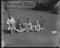 Gettle children sit on their lawn during William F. Gettle's kidnapping ordeal, Beverly Hills, 1934