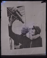 Father Jerome Ricard helps a student with a telescope at Santa Clara University, Santa Clara, 1924