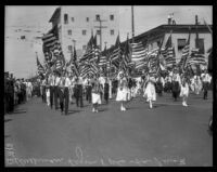 Members of the American Legion bearing flags at the La Fiesta de Los Angeles parade, Los Angeles, 1931