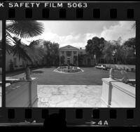 Courtyard and front façade of Conrad N. Hilton's mansion in Bel Air, Calif., 1979