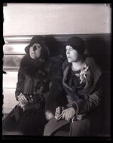 Wife and daughter of Asa Keyes wait to testify at his trial, Los Angeles, 1929