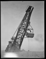 A steam shovel digging in the sand, Calexico, 1936