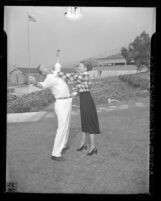 Los Angeles police candidate Irene LaQua tries out defense moves on Sgt. J.W. O'Bryan, 1948