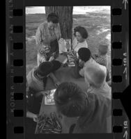 Elsa L. Frackelton and Iris Knapp reading to a group of boys at MacLaren Hall, a children's shelter in El Monte, Calif., 1964