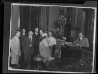 Clara Phillips and others before a judge in a courtroom during the time of her trial for the murder of Alberta Meadows, Los Angeles, 1922-1923