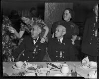 Civil War veterans John W. Harkrider and Joseph S. Detweiler enjoy Christmas dinner with their daughters, Los Angeles, 1938