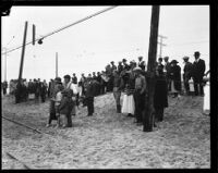 Spectators looking towards the charred remains of the Hope Development School for mentally disabled girls in Playa del Rey, Los Angeles, 1924