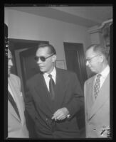 Franchot Tone (wearing sunglasses and smoking) soon after being released from the hospital, Los Angeles, 1951