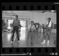 Peter Falk with Los Angeles Lakers Jim McMillian and Leroy Ellis during filming of "Colombo" television series, 1972