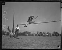 Elizabeth Stine, track athlete, engaged in high jump, circa 1922-1926