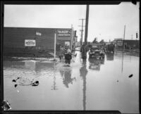 Slauson and Second Avenue flooded during or after a heavy rainstorm, Los Angeles, 1927