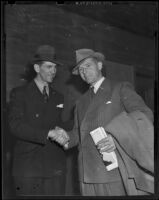 Elmer Layden and James Duval Phelan shake hands after Washington defeats Notre Dame, Los Angeles, 1938