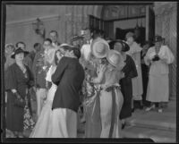 Guests surrounding Doris MacMahon and Hallam Cooley on their wedding day, Los Angeles, 1935