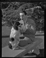 Entertainer Tito Guizar with a dog, Los Angeles, 1935